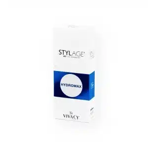 A white rectangular box stands upright with the text "STYLAGE" at the top, "HYDROMAX" in a blue circle in the middle, and "VIVACY" near the bottom. The box has a clean, minimalistic design with blue and grey accents. The product name is STYLAGE® HYDROMAX BI-SOFT®.