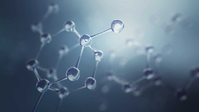 A close-up digital representation of molecular structures with interconnected atoms, depicted as small spheres connected by rods, on a soft, blue-tinted gradient background. The image gives a three-dimensional and slightly transparent appearance to the molecules.