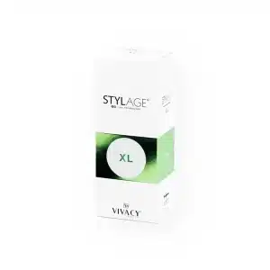 A white rectangular box with the brand name "STYLAGE® XL BI-SOFT®" in bold black letters near the top. Below the text is a green circular design with "XL" in the center. At the bottom, "Vivacy" is printed. The box stands upright on a white background.
