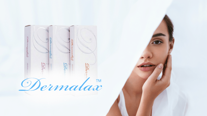A woman with clear skin gently touches her face while looking at the camera. To her left are three boxes of Dermalax skincare product, partially wrapped in white fabric. The word "Dermalax™" is prominently displayed in blue cursive text across the image, reminiscent of a positive Dermalax filler review.