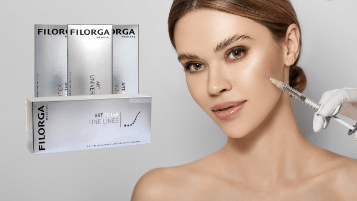 A woman receives an injectable treatment in her cheek, using Filorga The Filler. She has smooth, glowing skin and wears a neutral expression. In the background, there are three Filorga Art Filler boxes labeled "Universal," "Volume," and "Fine Lines.