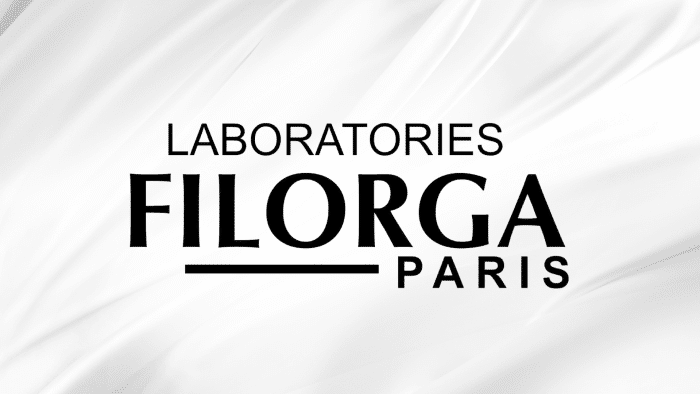 White background with flowing fabric-like texture, featuring the text "LABORATORIES FILORGA PARIS" in bold, black uppercase letters. A sleek representation that perfectly captures the elegance of a Filorga brand review.