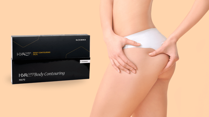 A person in white undergarments touches their thigh and buttock. To the side, there is a box labeled "HYACORP Body Contouring MLF2." The soft peach background complements the serene scene, inviting interest in HYACORP body contouring reviews.