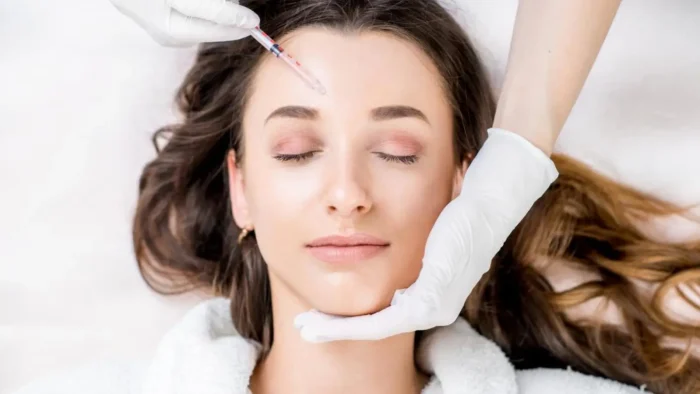 Woman getting facial injection.