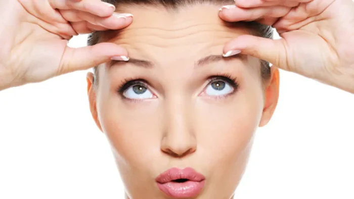 Woman with wrinkles on forehead.