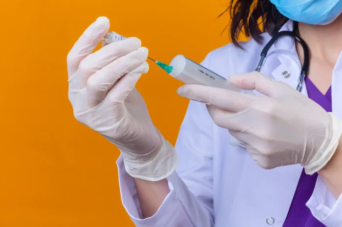 Person holding an injection.